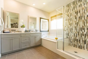 legant white and gray Atlanta bathroom with frameless glass shower
